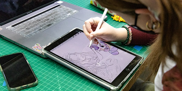 student working on digital pad