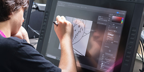 student working in photoshop